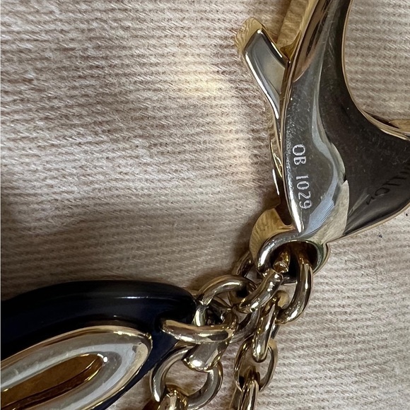 Authentic Louis Vuitton Insolence Bag Charm
Brass Hardware - Picture 2 of 5